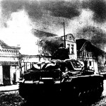 Belgrád égő külvárosában haladó német tankok